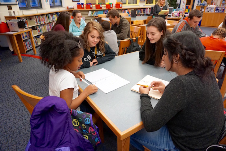 High school students partner with elementary students for mentoring program